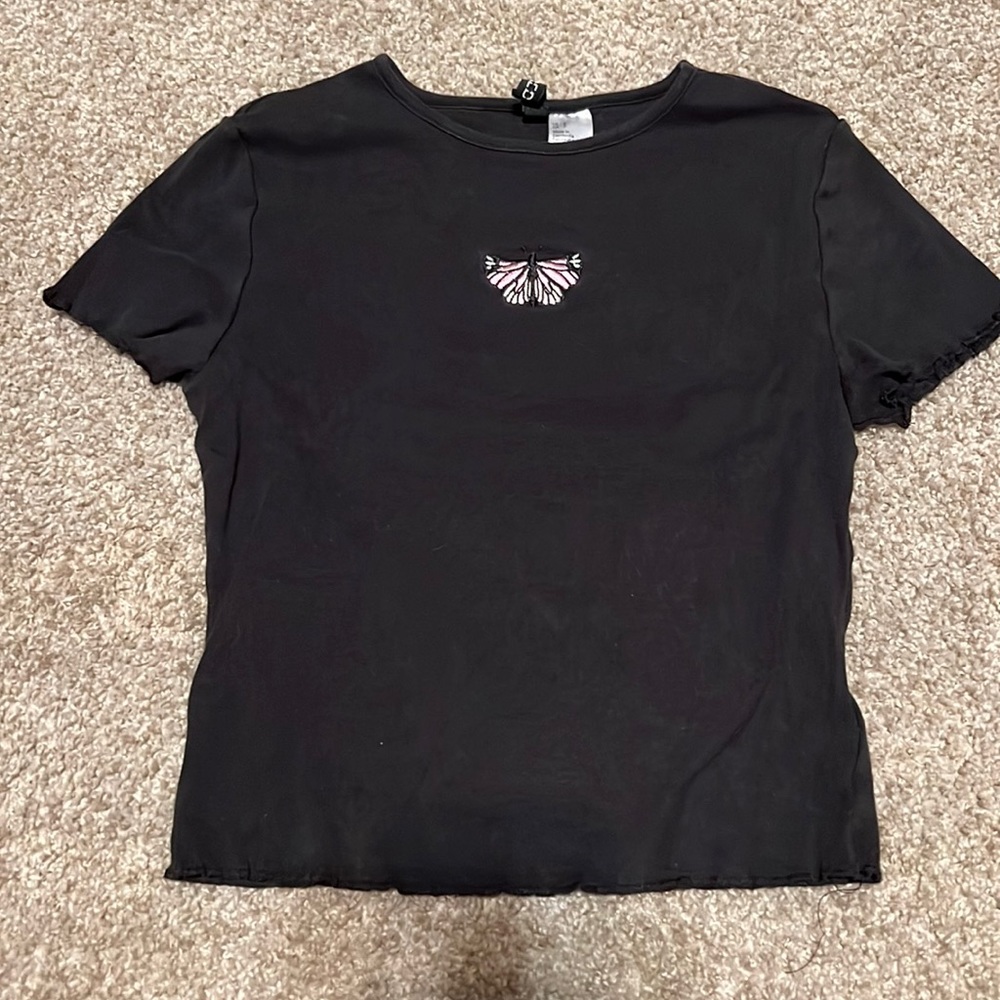 Black shirt with pink and purple butterfly on it from H&M lettuce trim